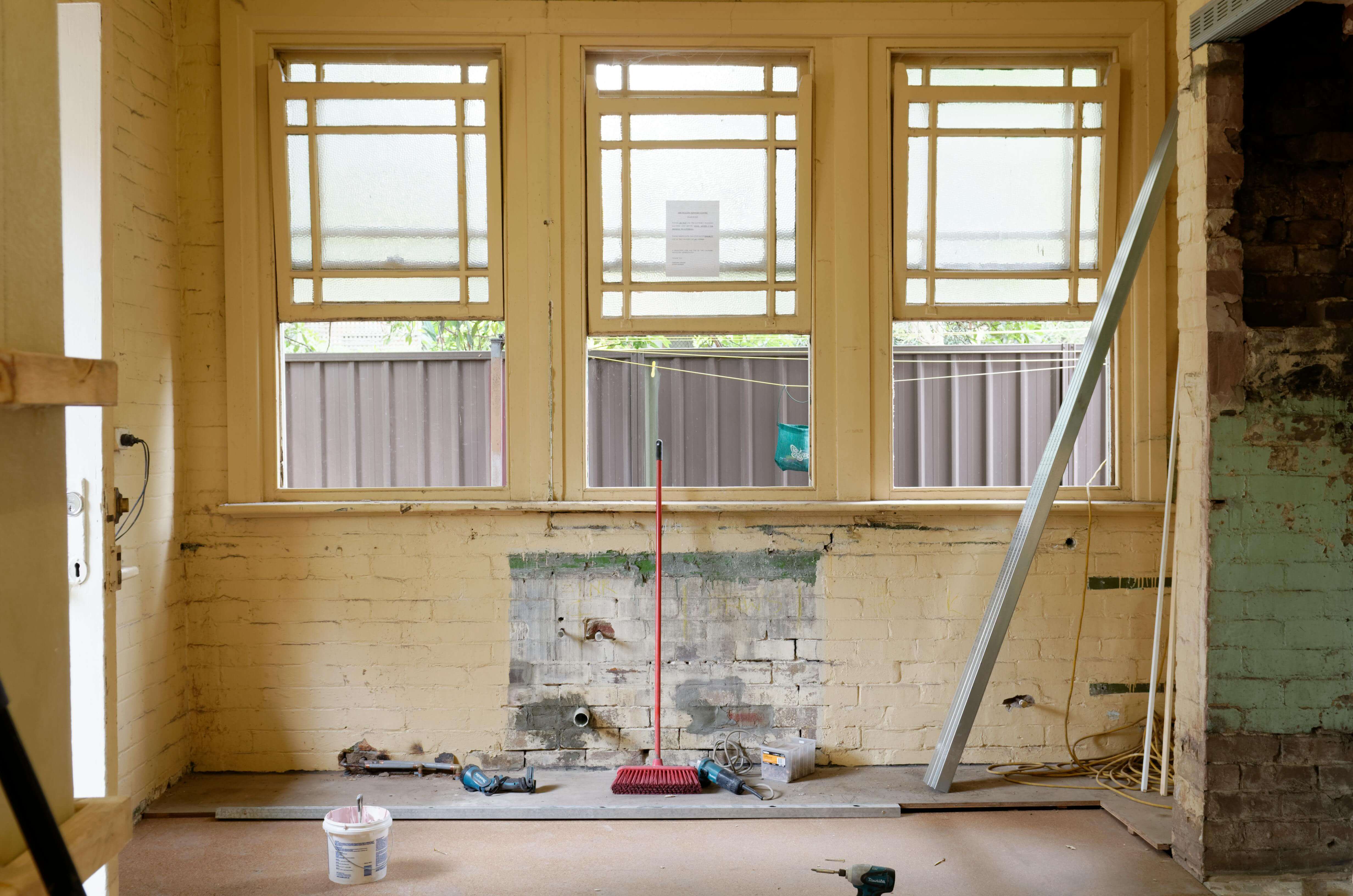 A brick wall inside a loft in need of repair
