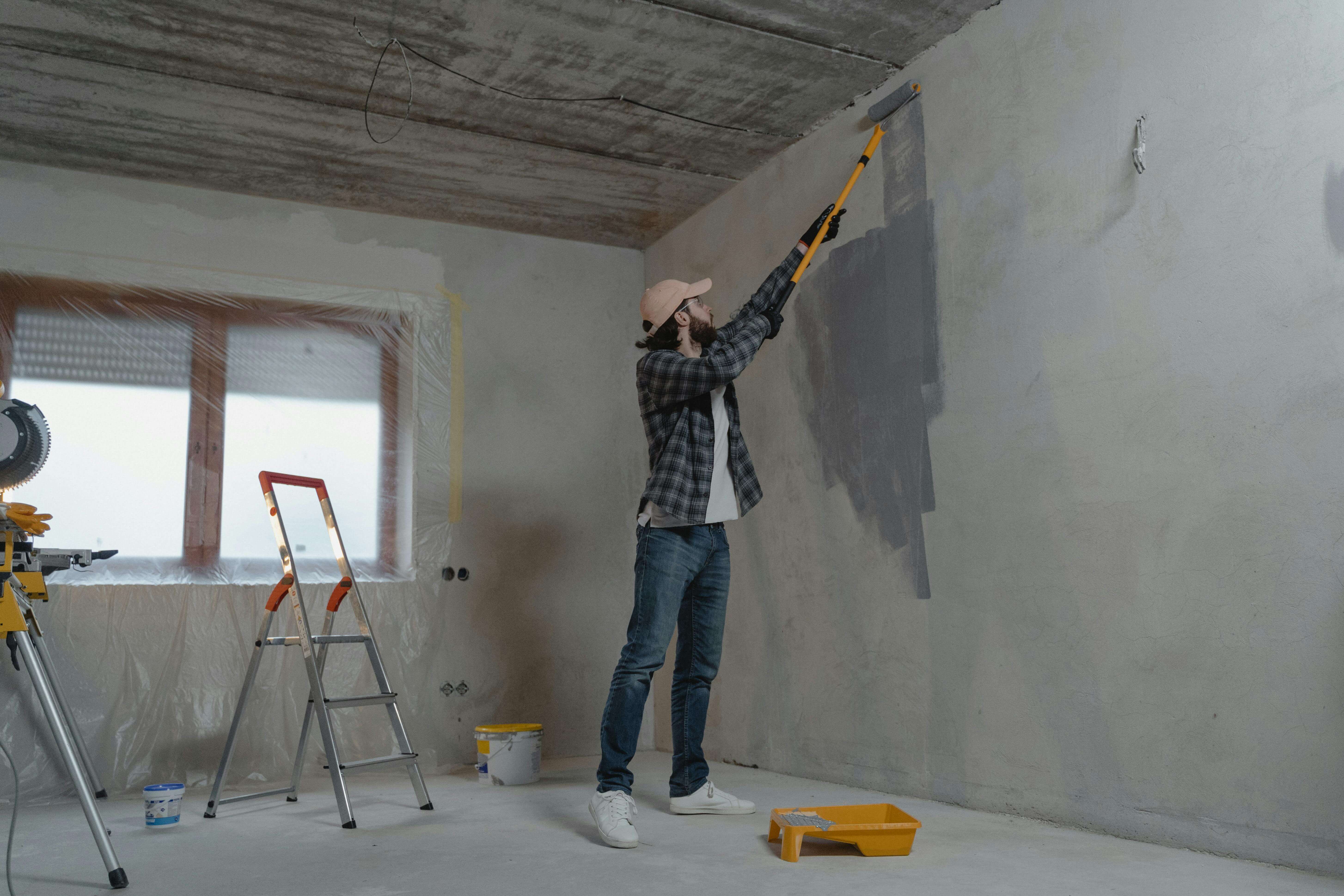 A worker is repairing a wall